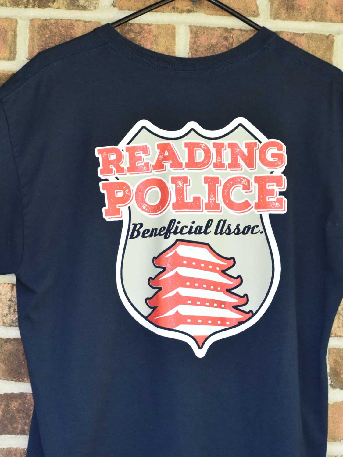 Close up of Reading Police Beneficial Assoc navy tshirt back