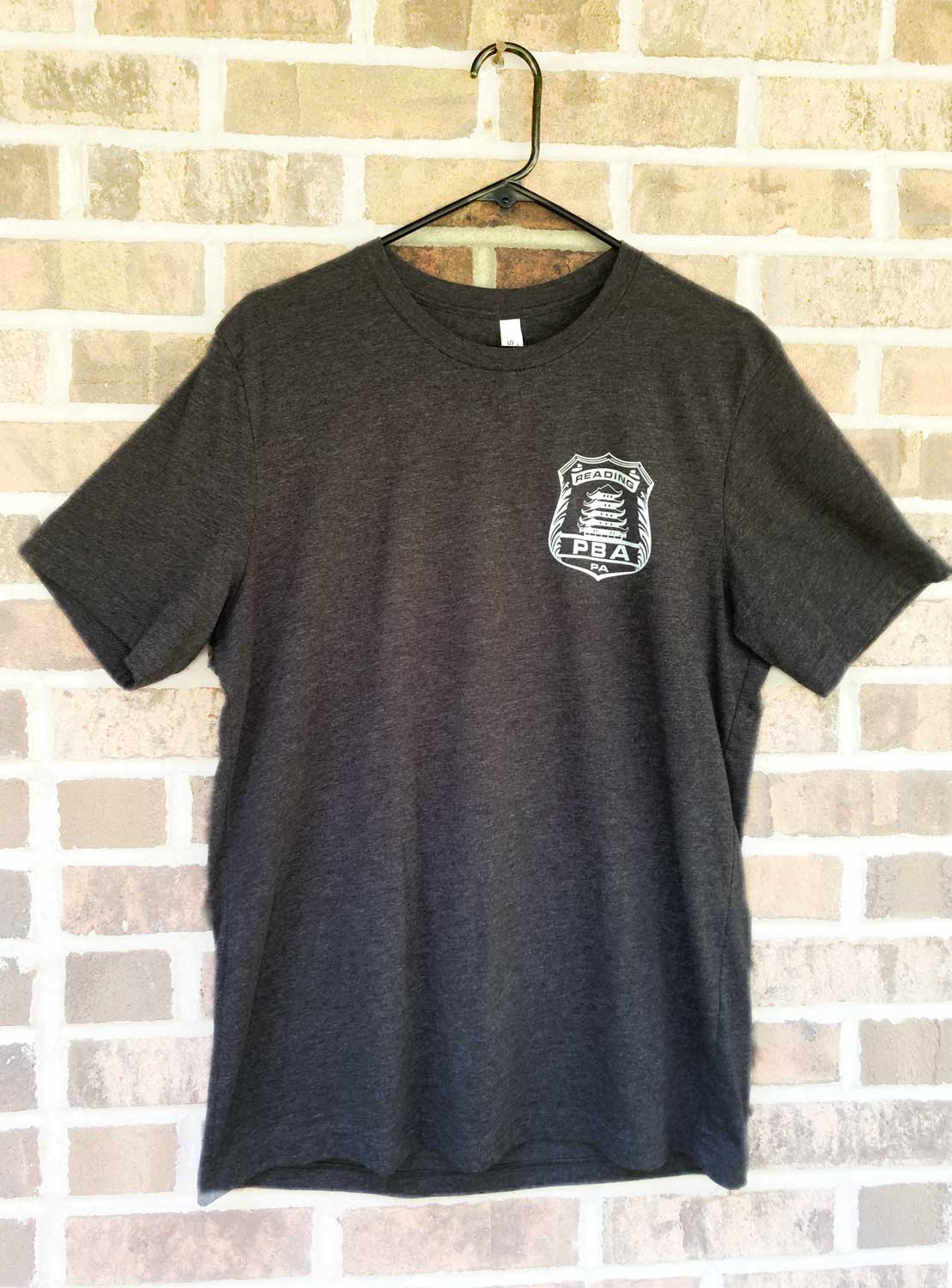 Front of RPBA Gray badge T-shirt